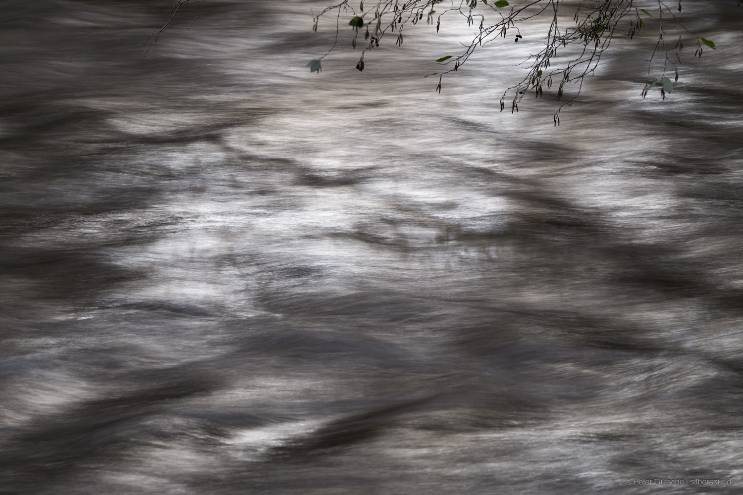 Flowing waters in a long-exposure photograph.